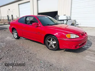 1999 Pontiac Grand Am GT z VIN 1G2NW12E4XM755047, wystawiony jako IAAI lot #42444969 z przebiegiem 242 591 mil mil oraz . Historia ofert i sprzedaży dostępna na DreamBid. Obrazek 1.