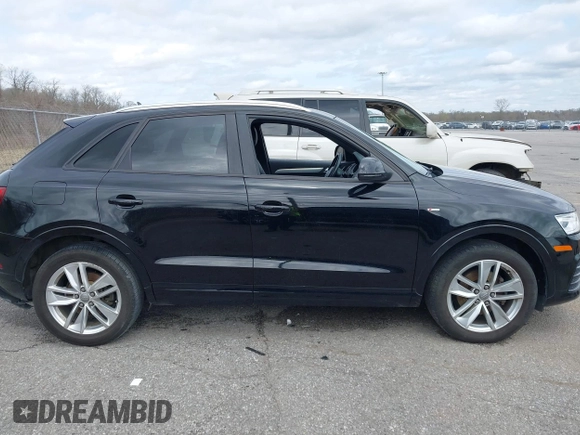 2018 Audi Q3 Premium z VIN WA1BCCFS8JR013032, wystawiony jako IAAI lot #41706173 z przebiegiem 111 402 mil mil oraz . Historia ofert i sprzedaży dostępna na DreamBid. Obrazek 13.