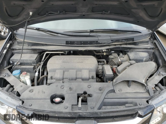2015 Honda Odyssey Touring Elite z VIN 5FNRL5H96FB047204, wystawiony jako Copart lot #56297985 z przebiegiem 125 482 mil mil oraz Szkoda całkowita • Salvage title. Historia ofert i sprzedaży dostępna na DreamBid. Obrazek 12.