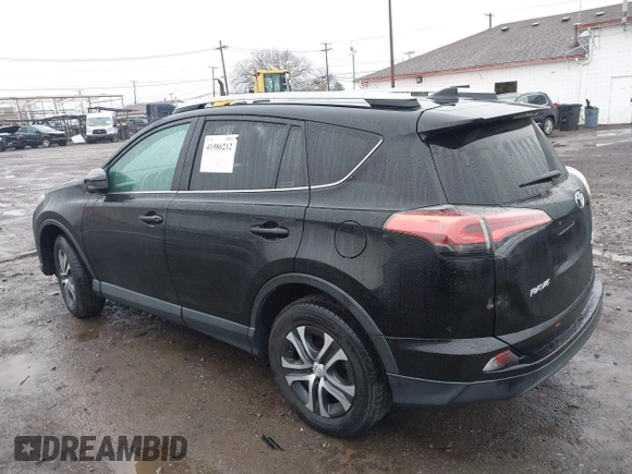 2018 Toyota RAV4 LE with VIN 2T3BFREV2JW788700, listed as a IAAI auction lot 41986212 with 87,704 mi miles. Bid and sale history available at carsss.com. Image 3.
