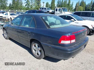 2000 Cadillac Catera z VIN W06VR54R3YR029454, wystawiony jako IAAI lot #42371242 z przebiegiem 166 182 mil mil oraz . Historia ofert i sprzedaży dostępna na DreamBid. Obrazek 3.