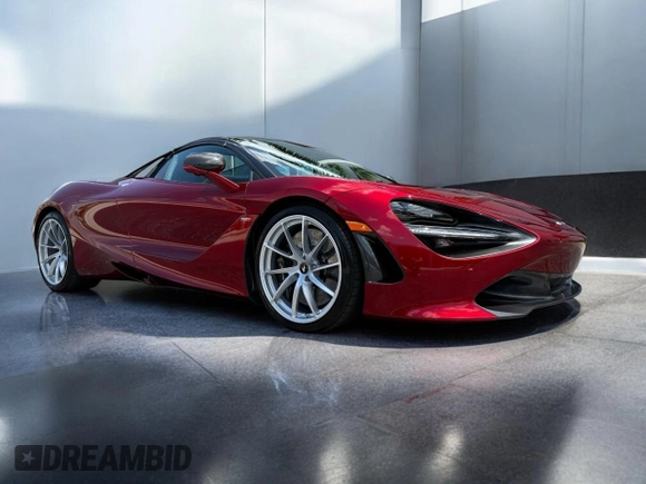 2022 McLaren 720S z VIN SBM14FCA2NW006XXX, wystawiony jako Copart lot #53583055 z przebiegiem 9223 mil mil oraz Tytuł czysty. Historia ofert i sprzedaży dostępna na DreamBid. Obrazek 1.