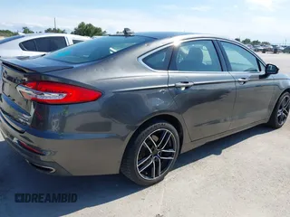 2019 Ford Fusion Titanium with VIN 3FA6P0D91KR104827, listed as a IAAI auction lot 42221526 with 141,316 mi miles and . Bid and sale history available at DreamBid. Image 4.