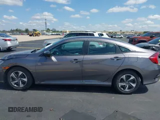 2020 Honda Civic LX with VIN 19XFC2F68LE007735, listed as a IAAI auction lot 42215294 with 3,849 mi miles and . Bid and sale history available at DreamBid. Image 14.