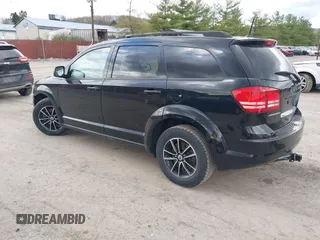 2018 Dodge Journey SE with VIN 3C4PDCAB1JT446005, listed as a IAAI auction lot 42001854 with 70,074 mi miles and . Bid and sale history available at DreamBid. Image 3.