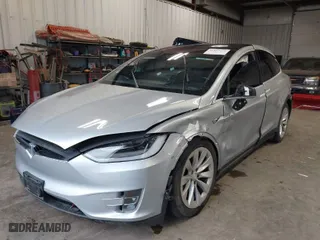 2018 Tesla Model X 75D with VIN 5YJXCDE28JF120932, listed as a IAAI auction lot 41899059 with 57,568 mi miles. Bid and sale history available at carsss.com. Image 2.