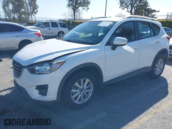 2016 Mazda CX-5 Sport with VIN JM3KE2BY9G0879654, listed as a IAAI auction lot 41819154 with 65,586 mi miles. Bid and sale history available at carsss.com. Image 18.