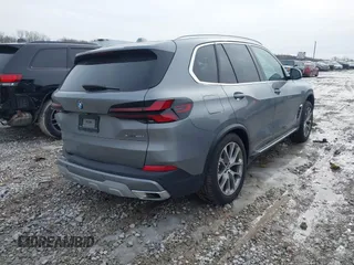 2025 BMW X5 xDrive40i with VIN 5UX23EU02S9X44610, listed as a IAAI auction lot 41469794 with 1,964 mi miles. Bid and sale history available at carsss.com. Image 4.