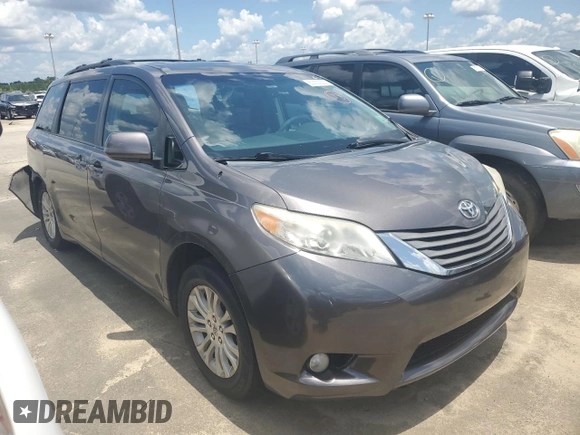2012 Toyota Sienna XLE AAS with VIN 5TDYK3DC1CS279575, listed as a Copart auction lot 60350235 with 275,287 mi miles and Salvage title. Bid and sale history available at DreamBid. Image 4.