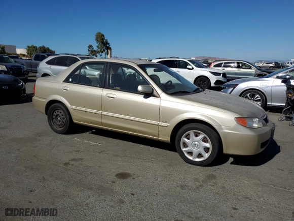 2002 Mazda Protege DX with VIN JM1BJ225521581079, listed as a Copart auction lot 76352594 with NaN miles and Salvage Title. Bid and sale history available at carsss.com. Image 4.
