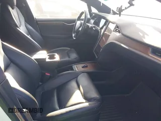 2021 Tesla Model X Long Range Plus with VIN 5YJXCDE29MF316169, listed as a IAAI auction lot 41232066 with 53,235 mi miles and . Bid and sale history available at carsss.com. Image 5.