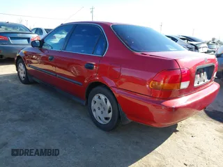 1997 Honda Civic LX with VIN 1HGEJ6678VL030963, listed as a IAAI auction lot 41880866 with 142,472 mi miles. Bid and sale history available at carsss.com. Image 3.
