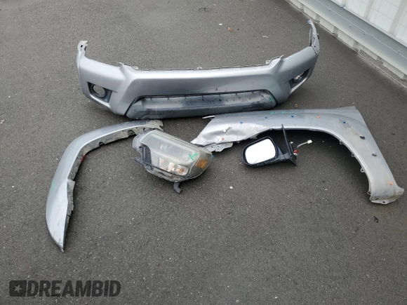 2015 Toyota Tacoma PreRunner with VIN 3TMKU4HN8FM046637, listed as a Copart auction lot 44077295 with 200,737 mi miles and Salvage title. Bid and sale history available at DreamBid. Image 12.