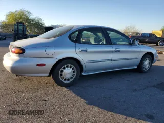 1996 Ford Taurus LX with VIN 1FALP53S9TG173438, listed as a Copart auction lot 77232114 with 89,789 mi miles and Clean title. Bid and sale history available at DreamBid. Image 3.