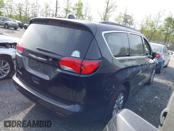 2021 Chrysler Voyager LXI with VIN 2C4RC1DG0MR506659, listed as a IAAI auction lot 42130000 with 121,350 mi miles. Bid and sale history available at carsss.com. Image 4.