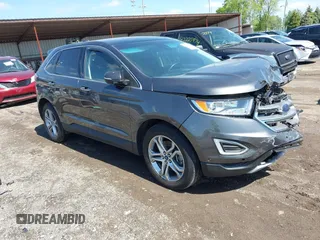 2015 Ford Edge Titanium z VIN 2FMPK4K83FBB30411, wystawiony jako IAAI lot #42230235 z przebiegiem 69 094 mil mil oraz . Historia ofert i sprzedaży dostępna na DreamBid. Obrazek 1.