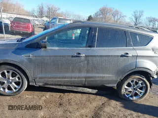 2014 Ford Escape SE z VIN 1FMCU9GXXEUB99093, wystawiony jako IAAI lot #41662040 z przebiegiem 120 783 mil mil oraz . Historia ofert i sprzedaży dostępna na DreamBid. Obrazek 15.