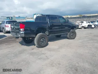 2016 Toyota Tacoma SR with VIN 3TMCZ5AN0GM023313, listed as a IAAI auction lot 41357990 with 103,335 mi miles. Bid and sale history available at carsss.com. Image 4.