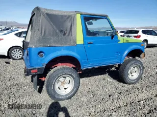 1986 Suzuki Samurai z VIN JS4JC51C8G4114216, wystawiony jako Copart lot #46191465 z przebiegiem 67 177 mil mil oraz Tytuł czysty. Historia ofert i sprzedaży dostępna na DreamBid. Obrazek 3.