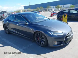2015 Tesla Model S 85D with VIN 5YJSA1H46FF081650, listed as a IAAI auction lot 39264096 with 84,899 mi miles. Bid and sale history available at carsss.com. Image 1.