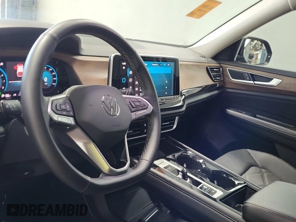 2024 Volkswagen Atlas SE with VIN 1V2HR2CA7RC565297, listed as a IAAI auction lot 42844488 with 24,398 mi miles and . Bid and sale history available at DreamBid. Image 4.