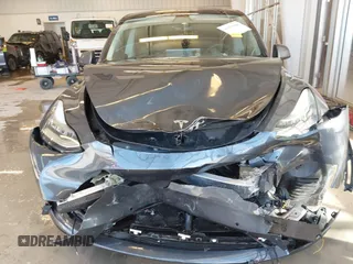 2021 Tesla Model Y Long Range with VIN 5YJYGDEE2MF087871, listed as a IAAI auction lot 41370004 with 85,757 mi miles. Bid and sale history available at carsss.com. Image 12.