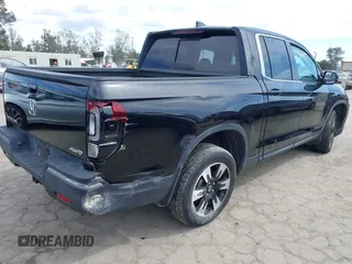 2020 Honda Ridgeline RTL with VIN 5FPYK3F53LB030107, listed as a IAAI auction lot 41933517 with 93,373 mi miles and . Bid and sale history available at DreamBid. Image 4.