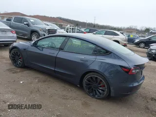 2023 Tesla Model 3 Performance with VIN 5YJ3E1EC9PF407365, listed as a IAAI auction lot 41956915 with 31,087 mi miles. Bid and sale history available at carsss.com. Image 3.