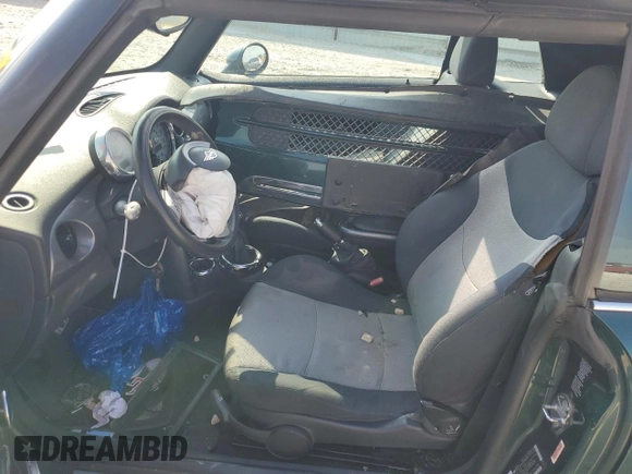 2007 MINI Convertible with VIN WMWRF33567TF66784, listed as a Copart auction lot 71571744 with 115,008 mi miles and Salvage Title. Bid and sale history available at DreamBid. Image 7.