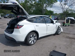 2021 Tesla Model Y Long Range z VIN 5YJYGDEE2MF200315, wystawiony jako IAAI lot #42233599 z przebiegiem 38 742 mil mil oraz . Historia ofert i sprzedaży dostępna na DreamBid. Obrazek 4.