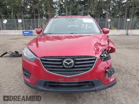 2016 Mazda CX-5 Grand Touring z VIN JM3KE4DY7G0687318, wystawiony jako IAAI lot #42228585 z przebiegiem 188 793 mil mil oraz . Historia ofert i sprzedaży dostępna na DreamBid. Obrazek 12.