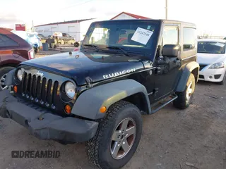 2011 Jeep Wrangler Rubicon with VIN 1J4HA6D11BL564211, listed as a IAAI auction lot 41242240 with 124,039 mi miles and . Bid and sale history available at carsss.com. Image 2.