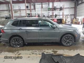 2023 Volkswagen Tiguan SE with VIN 3VVMB7AX5PM013447, listed as a IAAI auction lot 41615200 with 66,259 mi miles and . Bid and sale history available at DreamBid. Image 13.