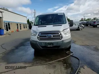 2018 Ford Transit with VIN 1FTYR1ZM1JKA58709, listed as a Copart auction lot 57285645 with 222,673 mi miles and Salvage title. Bid and sale history available at DreamBid. Image 15.