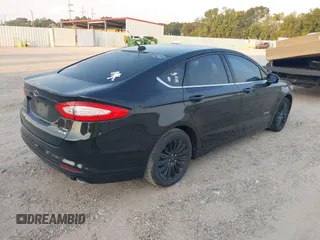 2015 Ford Fusion SE Hybrid with VIN 3FA6P0LU8FR310626, listed as a IAAI auction lot 40048581 with 124,086 mi miles and . Bid and sale history available at DreamBid. Image 4.
