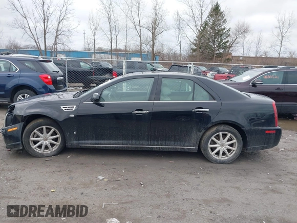 2009 Cadillac STS AWD z VIN 1G6DD67V290140111, wystawiony jako IAAI lot #41800236 z przebiegiem 81 913 mil mil oraz . Historia ofert i sprzedaży dostępna na DreamBid. Obrazek 13.