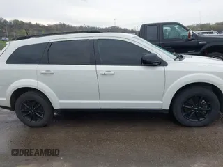2019 Dodge Journey SE with VIN 3C4PDCBB1KT845643, listed as a IAAI auction lot 41877311 with 85,824 mi miles and . Bid and sale history available at DreamBid. Image 14.