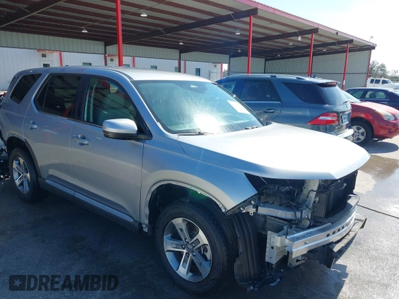 2023 Honda Pilot EX-L 8 Passenger with VIN 5FNYG2H42PB001292, listed as a IAAI auction lot 41594469 with 21,470 mi miles. Bid and sale history available at carsss.com. Image 1.
