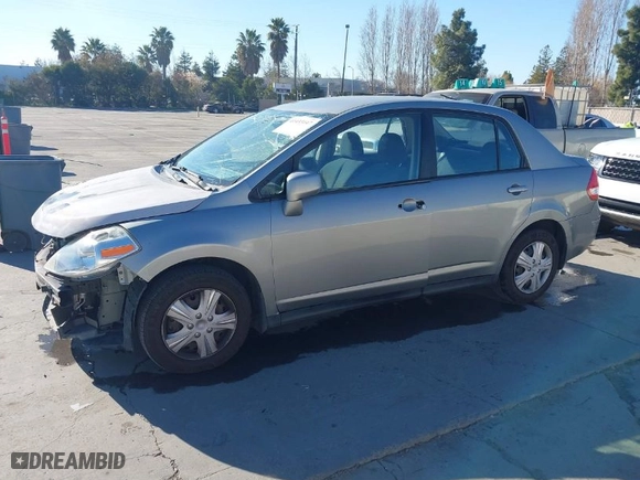 2010 Nissan Versa 1.8 S with VIN 3N1BC1AP2AL450998, listed as a IAAI auction lot 41433147 with 88,535 mi miles. Bid and sale history available at carsss.com. Image 2.