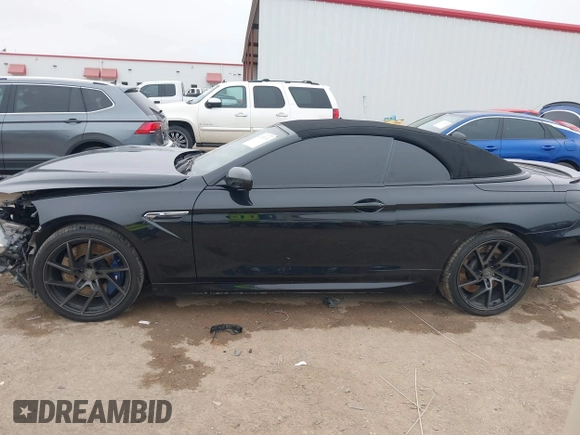 2014 BMW M6 z VIN WBSLZ9C58ED651156, wystawiony jako IAAI lot #41526192 z przebiegiem 90 642 mil mil oraz . Historia ofert i sprzedaży dostępna na DreamBid. Obrazek 14.