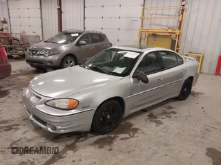 2004 Pontiac Grand Am GT with VIN 1G2NW52E04M617802, listed as a IAAI auction lot 41353209 with 103,716 mi miles. Bid and sale history available at carsss.com. Image 2.