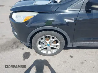 2013 Ford Escape SEL with VIN 1FMCU0H98DUB16061, listed as a IAAI auction lot 42046687 with 204,913 mi miles. Bid and sale history available at carsss.com. Image 6.