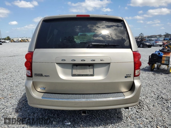 2014 Dodge Grand Caravan SXT z VIN 2C4RDGCG8ER266814, wystawiony jako Copart lot #52053155 z przebiegiem 279 551 mil mil oraz Tytuł czysty. Historia ofert i sprzedaży dostępna na DreamBid. Obrazek 6.