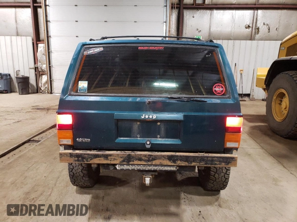 1996 Jeep Cherokee Sport with VIN 1J4FJ68S1TL226495, listed as a Copart auction lot 58587685 with 205,397 mi miles and Salvage title. Bid and sale history available at DreamBid. Image 6.
