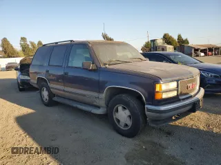 1999 GMC Yukon with VIN 1GKEK13RXXJ748733, listed as a Copart auction lot 74125914 with 172,766 mi miles and Clean Title. Bid and sale history available at carsss.com. Image 4.