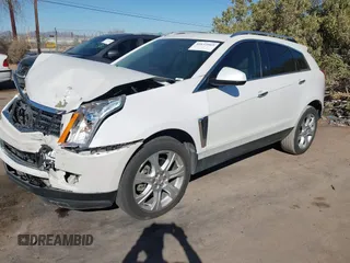 2013 Cadillac SRX Performance Collection with VIN 3GYFNDE37DS599557, listed as a IAAI auction lot 41633569 with 100,611 mi miles and . Bid and sale history available at DreamBid. Image 2.