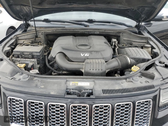 2014 Jeep Grand Cherokee Summit with VIN 1C4RJFJG1EC323658, listed as a Copart auction lot 50740115 with 253,656 mi miles and Salvage title. Bid and sale history available at DreamBid. Image 13.