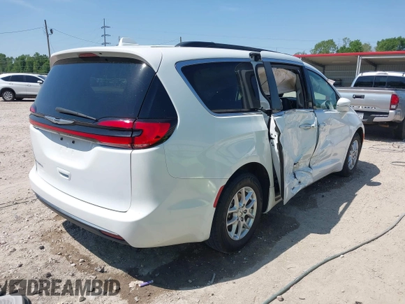 2022 Chrysler Pacifica Touring L with VIN 2C4RC1BG4NR191644, listed as a IAAI auction lot 41979011 with 84,789 mi miles and . Bid and sale history available at DreamBid. Image 4.