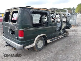 1999 Ford Econoline Cargo with VIN 1FDRE14W8XHB48532, listed as a IAAI auction lot 41513497 with Not Provided miles. Bid and sale history available at carsss.com. Image 4.