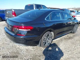 2020 Volkswagen Passat 2.0T SEL with VIN 1VWCA7A35LC012673, listed as a IAAI auction lot 41215951 with 100,095 mi miles. Bid and sale history available at carsss.com. Image 4.